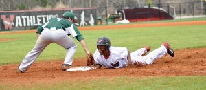 Westwood’s Quinton Wilson dives safely back to first base during Saturday’s pitchers’ duel against Dutch Fork. (Photo/DeAnna Robinson)