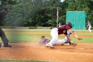 RWA catcher Chris Christianson reaches to place the tag on the Saints’ baserunner in Monday’s game one. (Photo/Martha Ladd)