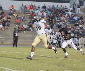 Quentin Thompson (12) hauls in his third of three TD passes from Stanley McManus Friday. (Photo/DeAnna Robinson)