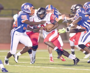 Rudy Mitchell drives against the RNE defense. (Photo/Ross Burton)