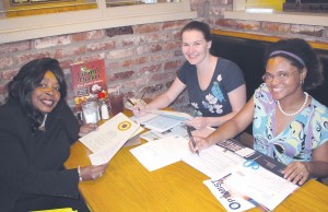 At work in their ‘office’ at Lizard’s Thicket in Blythewood, Optimists Lola Cumbo, Keri Boyce and Sierra Kelly plan their club’s first banquet set for Saturday night at Round Top Baptist Church. (Photo/Barbara Ball)