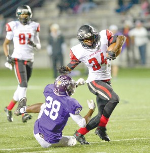 Rudy Mitchell (34) shakes a Northwestern tackle. (Photo/Ross Burton)