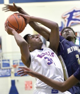 Keith Matthews (2) bangs bodies with Byrnes’ K. Williams Tuesday night. (Herald-Journal)
