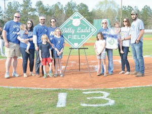 Richard Winn Academy officially dedicated its baseball field in honor of the late Billy Ladd, who passed away Feb. 26. Ladd was a fixture for many years of RWA athletics, particularly Eagles baseball. In a ceremony before last Friday’s game with Fairfield Central, members of the Ladd family gather around home plate for the dedication. From left are: James Sims, Callie Ladd Sims holding Anne Lightcap, Jamie Lightcap, Simon Lightcap, Frances Ladd Lightcap, Lucy Lightcap, Bella Lightcap, Martha Ladd, Meg Ladd holding Sophie Lightcap and William Ladd. (Photo/DeAnna Robinson)