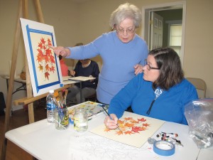 Instructor Kitty Rabb of Winnsboro instructs Sharon Swofford of Ridgeway in watercolor technique. (Photo/Barbara Ball)