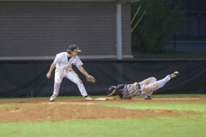 Blythewood’s Jordan Flemming takes a tumble going hard into third Monday at Spring Valley. (Photo/Kristy Kimball Massey)
