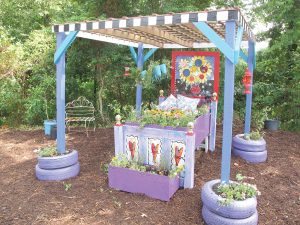 This whimsically painted ‘flower bed’ made from discarded items, was featured in artist Christy Buchanan’s painted garden during Fairfield County’s Ag & Art Tour last year.