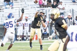 Fairfield Central QB Stanley McManus (10) unloads ahead of pressure from the RNE defense. (Photo/Kristy Kimball Massey)