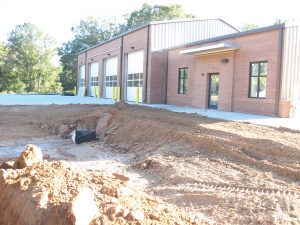 The new Ridgeway fire station and the retention pond that slipped by County Council during the planning stages. The pond, and its counterpart at the Jenkinsville station, will be filled in and grassed over as a catch basin. (Photo/Barbara Ball)
