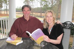 Chuck and Debbie Kegley, holding their book, “After A Stoke Strikes,” relax on the back porch of their home in Cobblestone Park overlooking the fairway. (Photo/Barbara Ball)