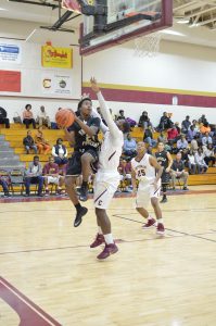 Jalen Mazyck (24) grinds his way to the hoop for the Griffins. (Photo/DeAnna Robinson)