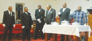 Serving Communion during the Night Watch are Deacons Clifton Hendrix, Clarence Lyles, Lawrence Coleman, John Peoples, Thomas Coleman and the Rev. Eric Bell. (Photo/Clifton Hendrix)